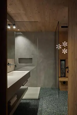 a bathroom with a sink and a glass shower at Mountain Lodge Margit in Maranza