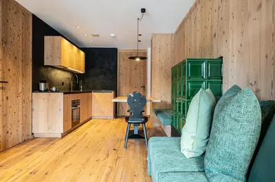 a living room with a couch and a table at Mountain Lodge Margit in Maranza