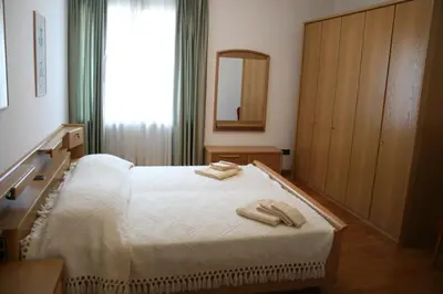 a bedroom with a bed with two towels on it at le stanze di Saraswati in Salorno sulla Strada del Vino