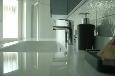 a bathroom with a sink and a faucet at le stanze di Saraswati in Salorno sulla Strada del Vino