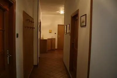 a hallway leading to a kitchen in a room with at le stanze di Saraswati in Salorno sulla Strada del Vino