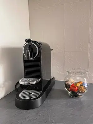 a toaster sitting on a counter with a bowl of food at Apartments Rainer - Val Gardena in Ortisei