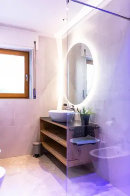 a bathroom with a sink and a mirror at Apartments Rainer - Val Gardena in Ortisei