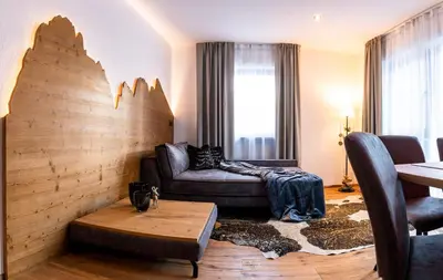 a living room with a couch and a table at Apartments Rainer - Val Gardena in Ortisei