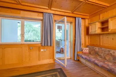 a living room with a couch and a window at Appartement Sonneck in Lappago