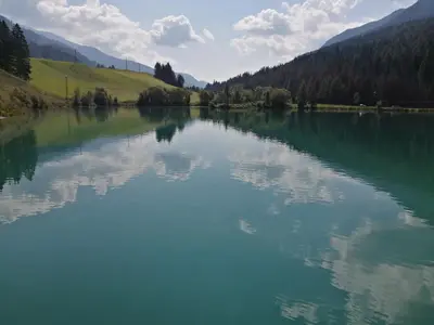a view of a lake with mountains in the background at Appartement Sonneck in Lappago