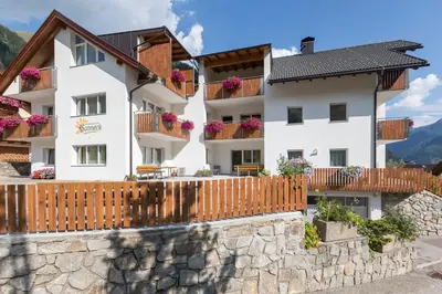 a building with balconies and a fence at Appartement Sonneck in Lappago