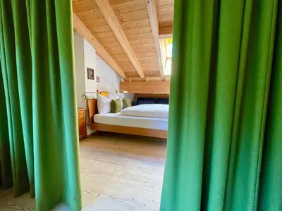 a bedroom with two beds with white pillows at Apartments DA LA VEDLA Flats in San Cassiano