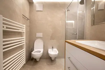 a bathroom with a toilet and a sink and a shower at Apartment Fina in Ortisei