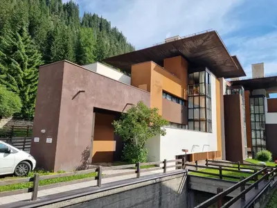 a house with a car parked in front of it at Casa Gallo in Mazzin
