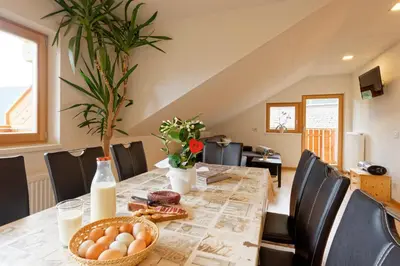 a dining room table with eggs in a basket at Kehrerhof Urlaub auf dem Bauernhof in San Lorenzo di Sebato