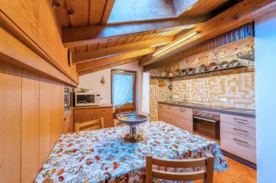 a kitchen with a table with a bowl on it at Tizzi Home in Alleghe