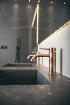 a bathroom counter with a sink and a fossasteryasteryasteryasteryasteryasteryastery at Apartment 901 in Bressanone