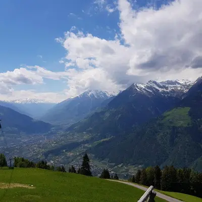 a mountain view of a valley with snow capped mountains at Rooftop-Schenna in Schenna