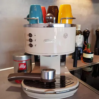 a white coffee maker sitting on top of a stove at Rooftop-Schenna in Schenna