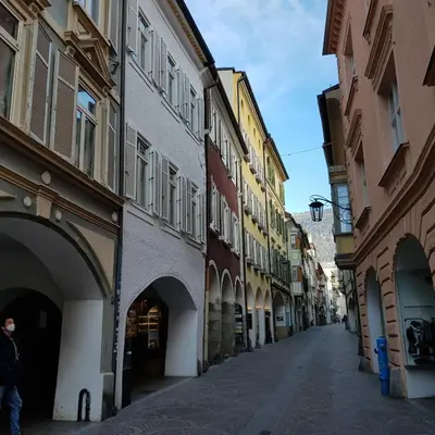 an empty street in a city with buildings at Rooftop-Schenna in Schenna