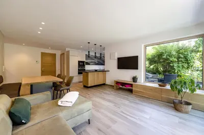 a living room with a couch and a table at Apartment Dauru in Ortisei