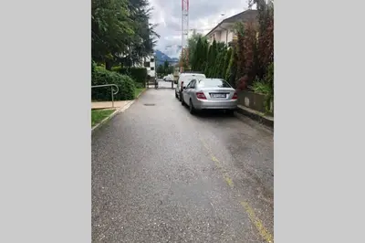 a car parked on the side of a street at Brunico 19 in Brunico