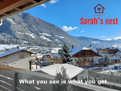 a snowy town with a mountain in the background at Sarah's nest - your mountain resort in Villa Ottone