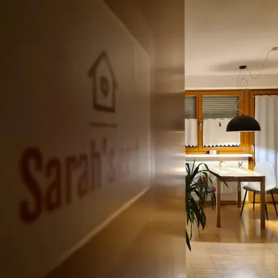 a room with a table and a dining room at Sarah's nest - your mountain resort in Villa Ottone