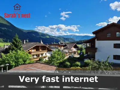 a view of a town with mountains in the background at Sarah's nest - your mountain resort in Villa Ottone
