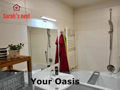 a bathroom with a tub and a sink and a shower at Sarah's nest - your mountain resort in Villa Ottone
