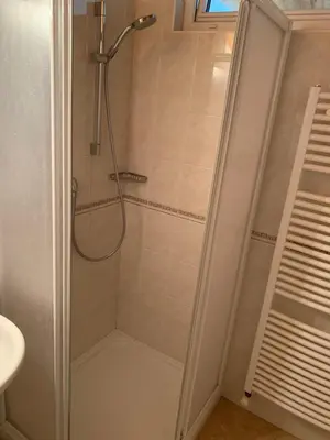 a shower with a glass door in a bathroom at Santlhof - Sauvignon in Cortaccia