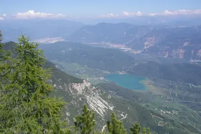 a view of a mountain valley with a lake at Santlhof - Sauvignon in Cortaccia