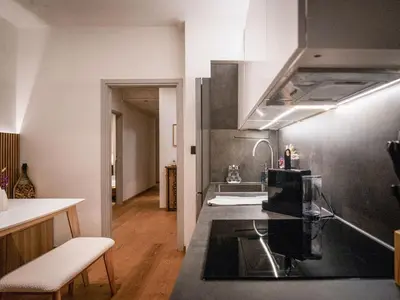 a kitchen with a sink and a counter top at Bergblick Apartment in Zentrumsnähe mit Garage in Merano