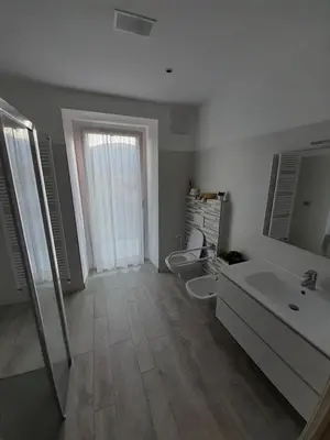 a bathroom with a toilet and a sink and a tub at B&B ANGELA Valdinon in Predaia