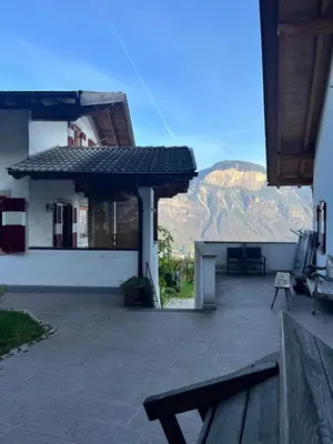 a view of a house with a view of a mountain at Für 4-6 Wohnhaus im Weinberg - Voldersberghof in Penone