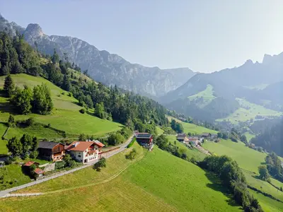 a green valley with houses and a train on a hill at Veraltenhof Agriturismo B&B in Tires