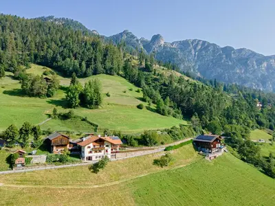 an aerial view of a house on a green hill at Veraltenhof Agriturismo B&B in Tires