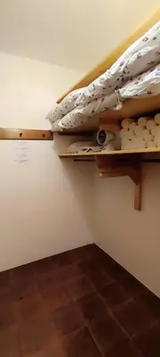 a small room with a bunk bed on the wall at Große Wohnung mit Garagenparkplatz in Vols am Schlern