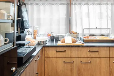 a kitchen with a counter with food on it at Villa Resi B&B in Corvara in Badia