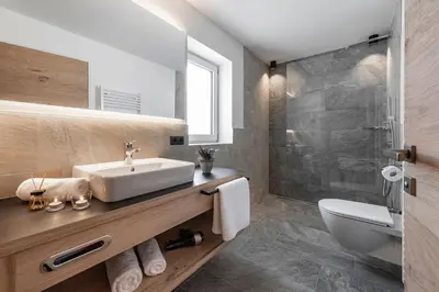 a bathroom with a sink and a shower at Guesthouse Plose in Bressanone