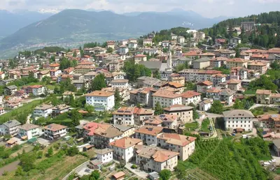 a small town on a hill with houses at 