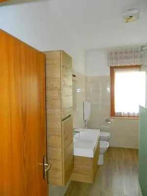 a bathroom with a tub and a toilet and a sink at 