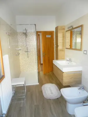 a bathroom with a sink and a shower and a toilet at 
