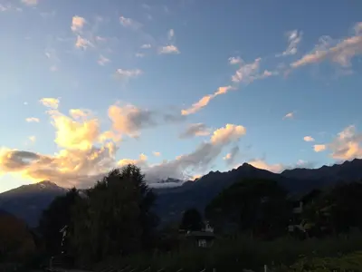 a view of the mountains with a cloudy sky at sleep & go -Meran easy staying in Merano
