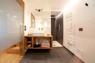 a bathroom with a sink and a mirror at B&B fiordimelo in Cavalese