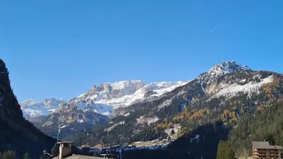 a view of a mountain range with snow covered mountains at Appartamento Cesa Lamar in Canazei