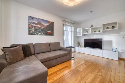 a living room with a couch and a flat screen tv at FaWa Apartments 