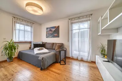 a living room with a couch and a tv at FaWa Apartments 