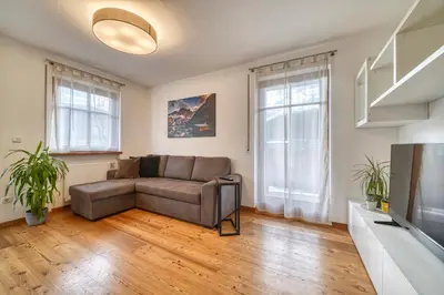 a living room with a couch and a television at FaWa Apartments 