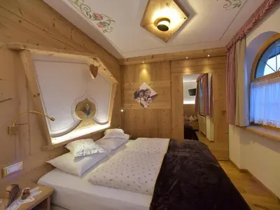 a bedroom with a bed in a room at Hotel Cesa Padon in Arabba