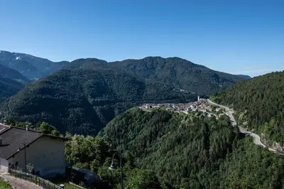 a view of a mountain with a road on it at Appartamento alla Brisa Grauno Ospitar in Grauno