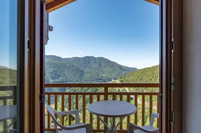 a view from a balcony with a table and chairs at Appartamento al Sol Grauno Ospitar in Grauno
