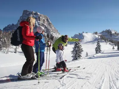 a group of people on skis on a ski slope at Cesa da Riz in Colle Santa Lucia