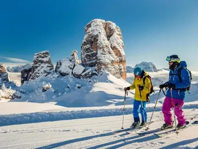 two people on skis standing in the snow at Cesa da Riz in Colle Santa Lucia